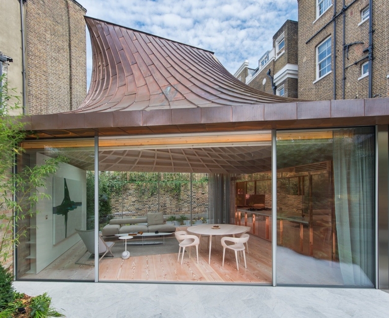 A Dramatic Copper Roof Funnels Light Into This Sculptural London Home