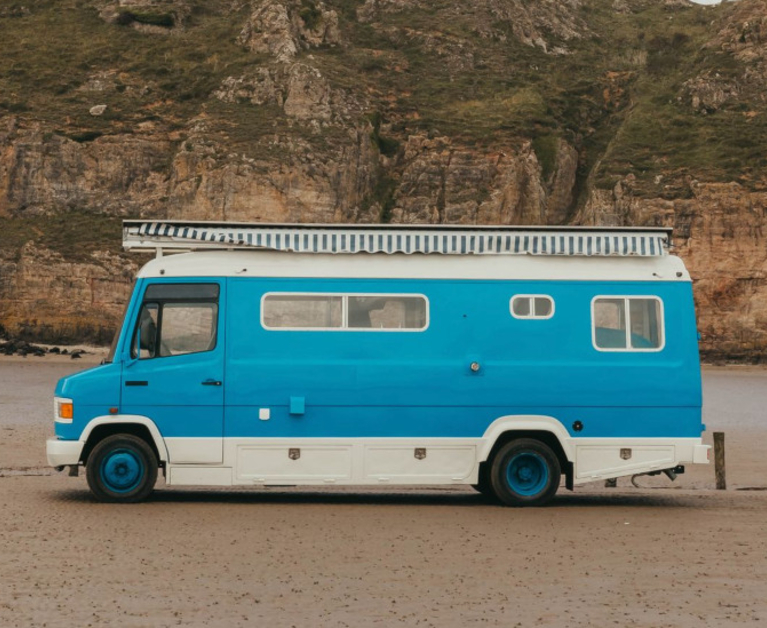 Old van converted into solar-powered bohemian beach hut on wheels