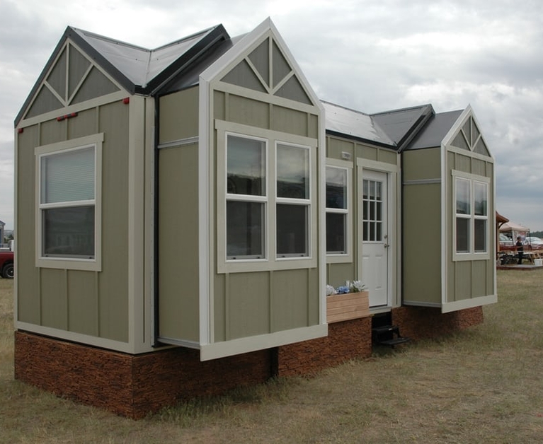 This tiny house expands in size with the push of a button