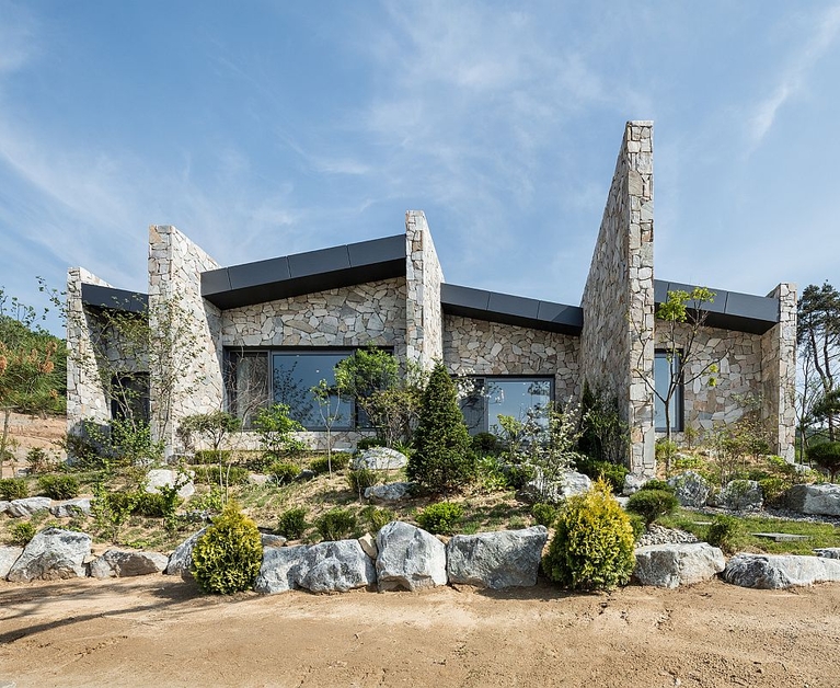 Serene Rustic Retreat with Stone Walls Blends into the Landscape