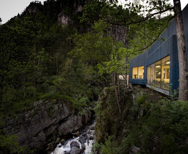 A house on the verge of a waterfall