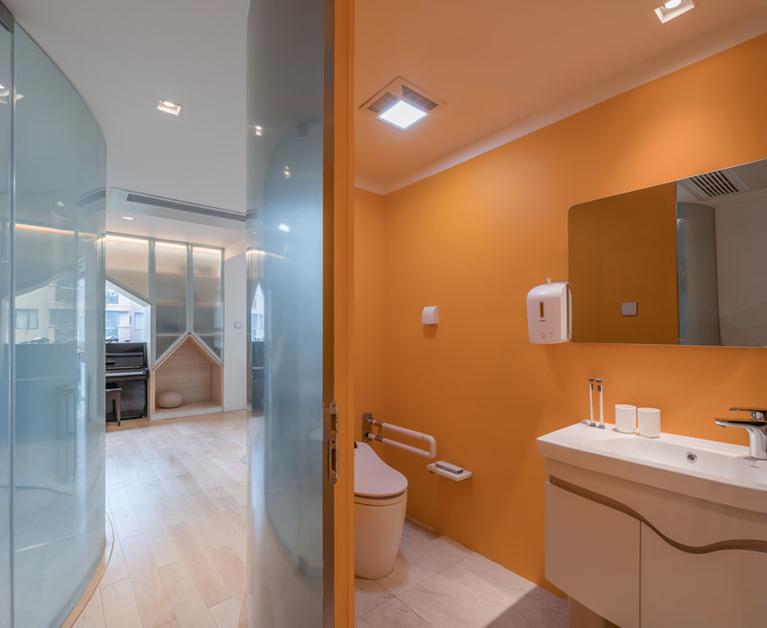 This Apartment Was Designed With A Calm Color Palette And A Fun Slide For The Kids