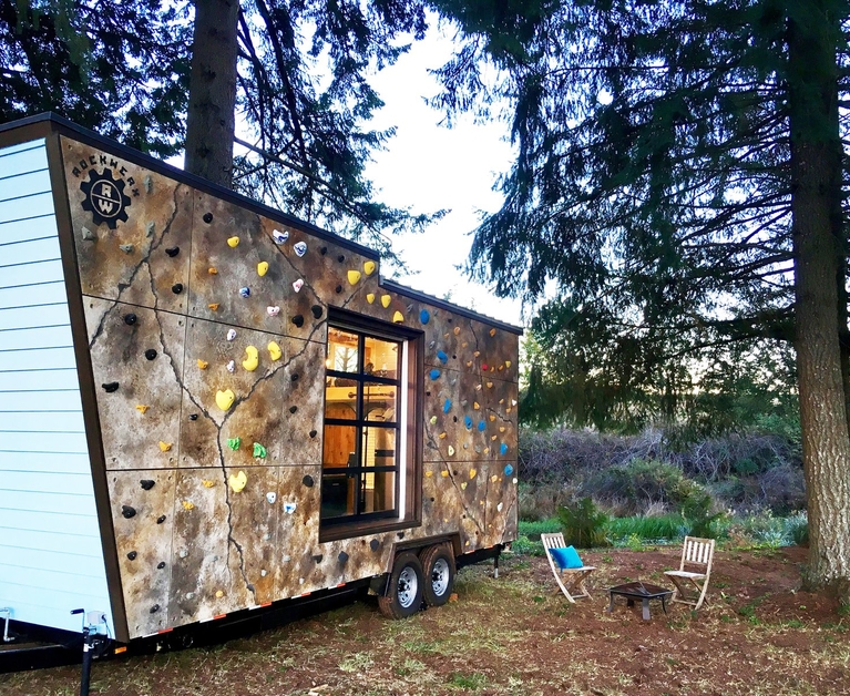 Tiny home with a nifty climbing-wall facade