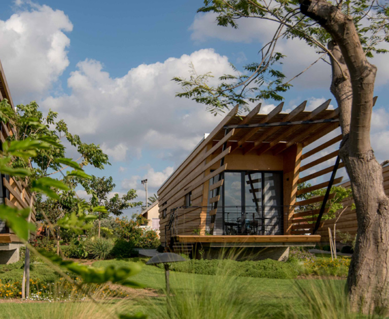 Timber tiny houses with bold pergolas