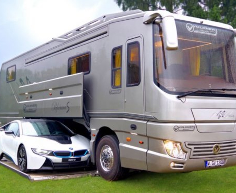 This RV Has an Onboard Garage for Your Car