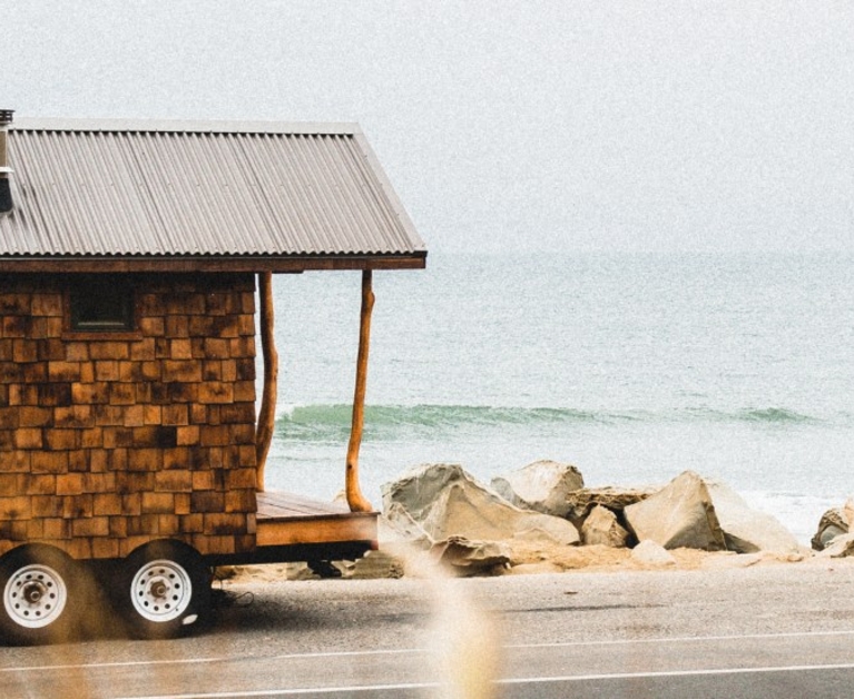 The adorable tiny cabin is made of wood salvaged from an old mansion