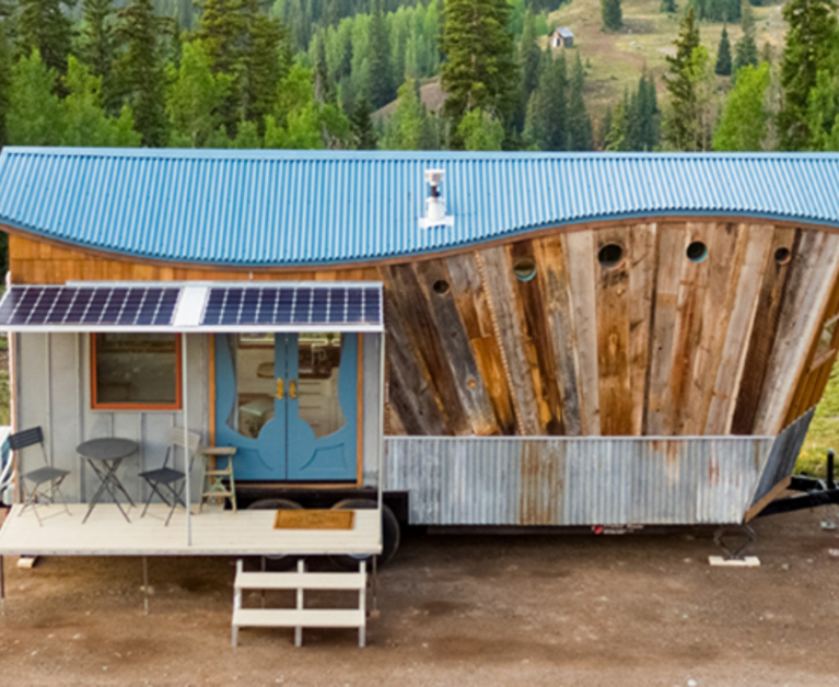 Off-grid tiny home with beautiful undulating roof