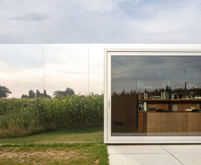 Shipping containers turned into mirrored architects' studio