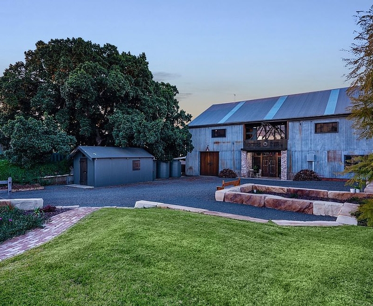 Behind this historic hay shed hides an incredible family home